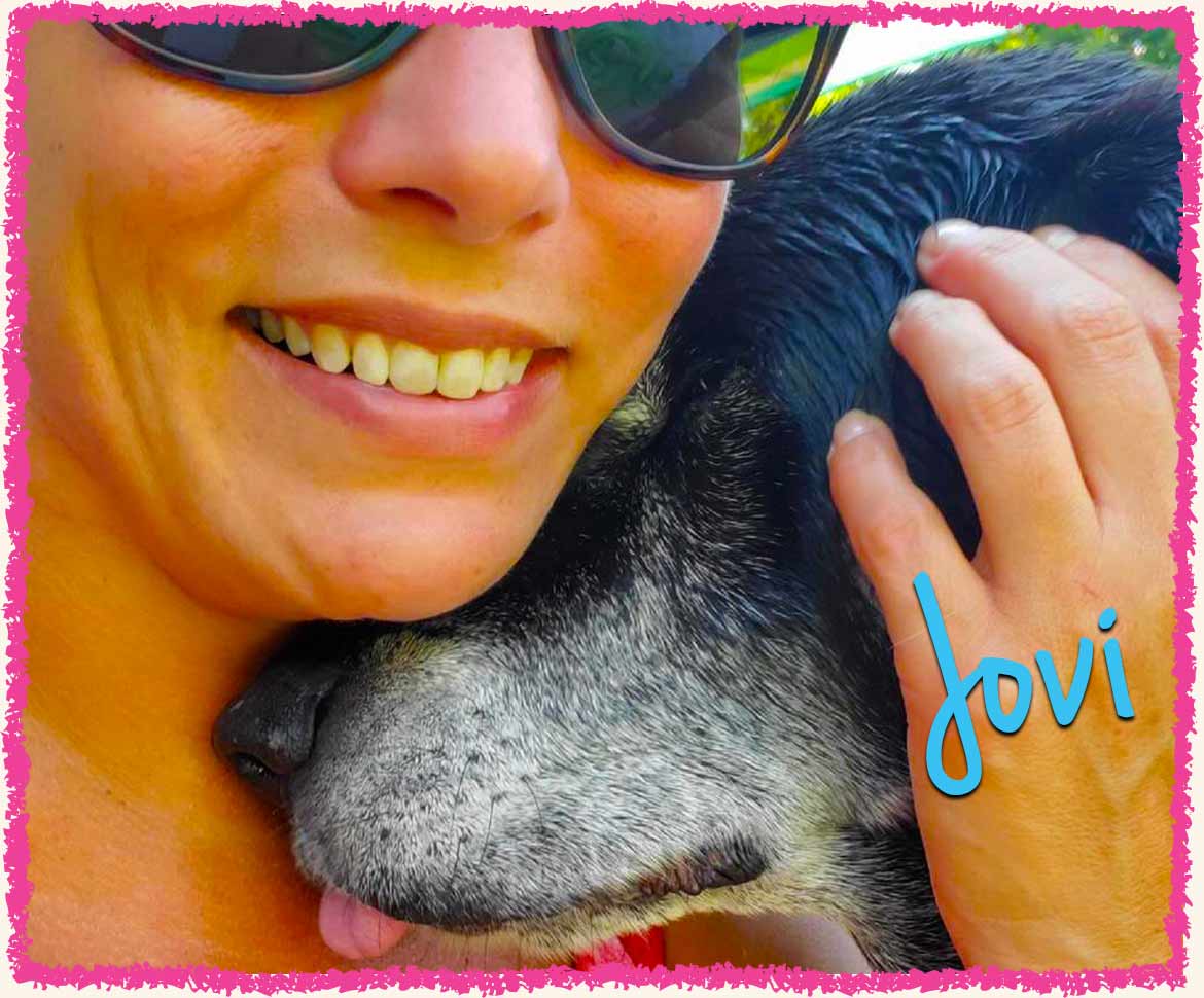 Bridget cuddling black Lab Jovi