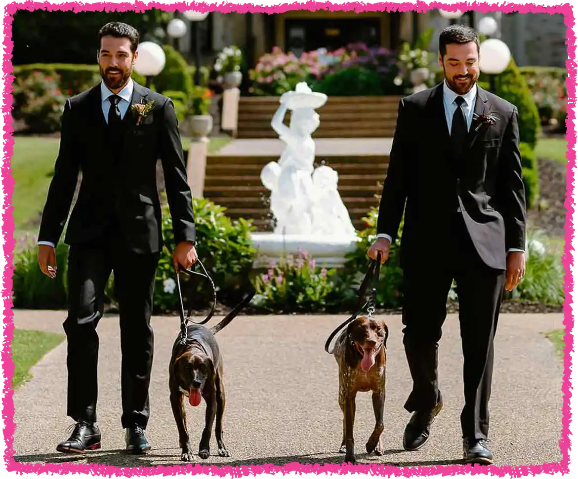 The two men walking the two dogs toward the venue.